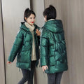 Women's loose thick hooded winter jacket in acrylic fabric on a hanger
