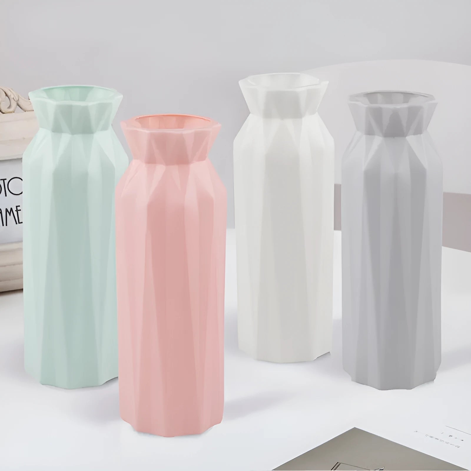 Green drop-resistant melamine plastic vase with 7.2cm base on a wooden desk.