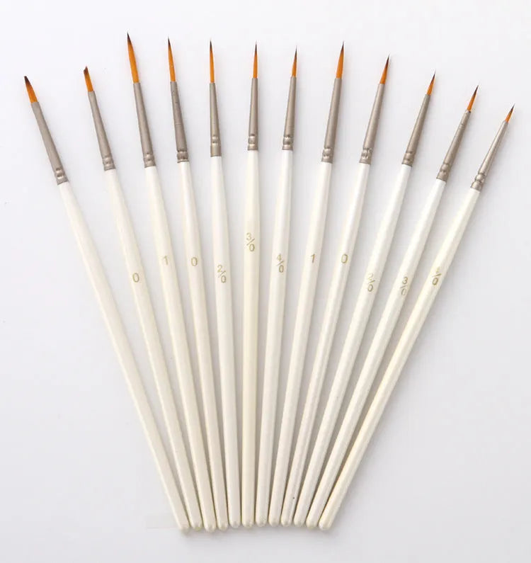 Set of 12 Pearl White artist paint brushes with nylon wool bristles, metal ferrules, and wooden handles.