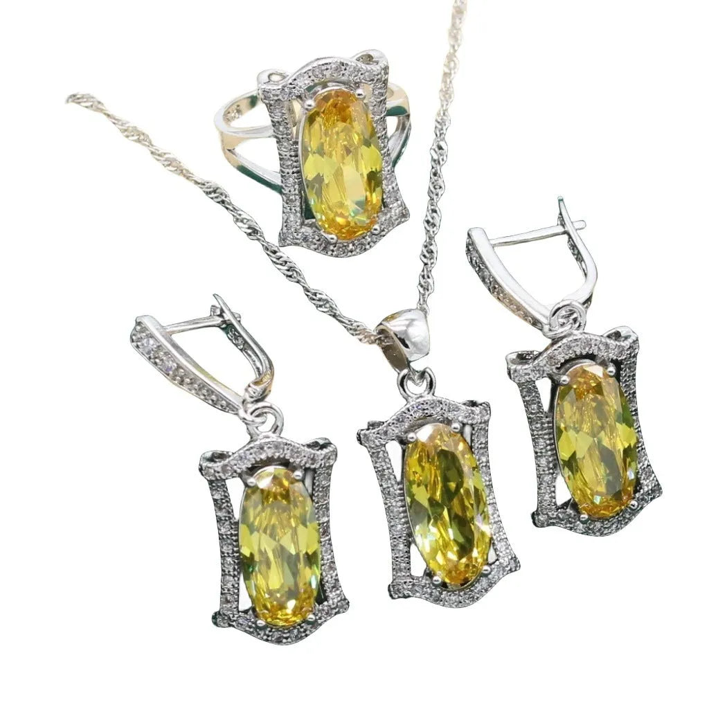 Yellow and olive anti-allergy zircon jewellery set with necklace, earrings, ring, and bracelet on a snake bone chain.