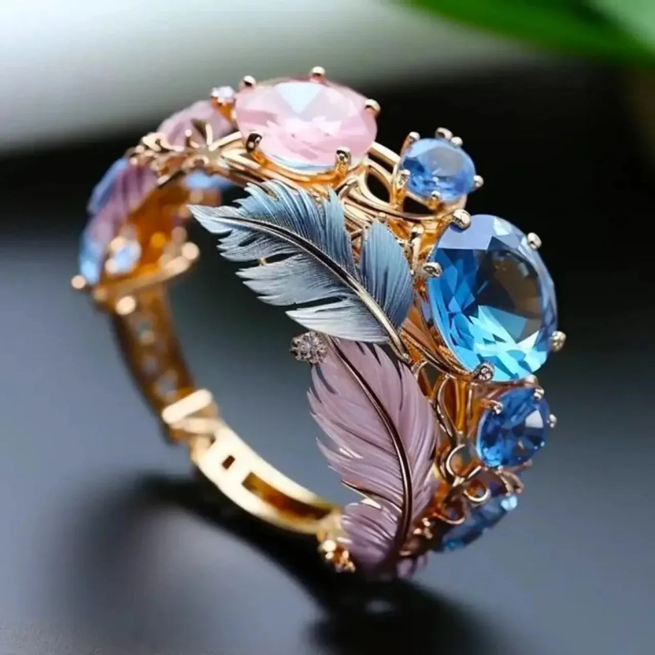 Gold brass feather ring with embossed colourful geometric design and zircon details
