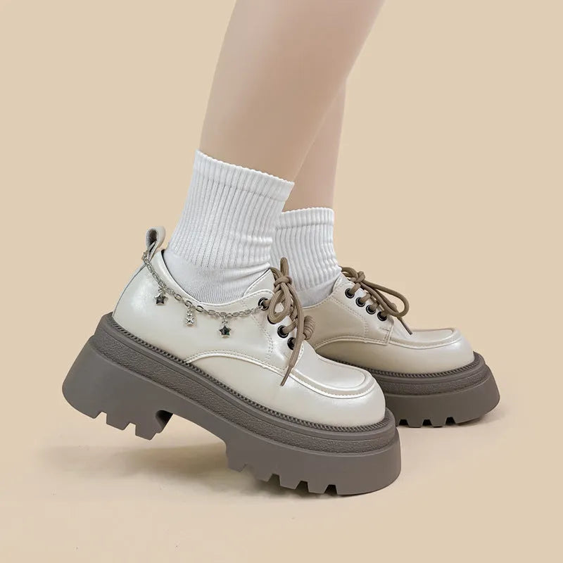 White platform Mary Jane leather shoes with chunky heel and lace-up closure