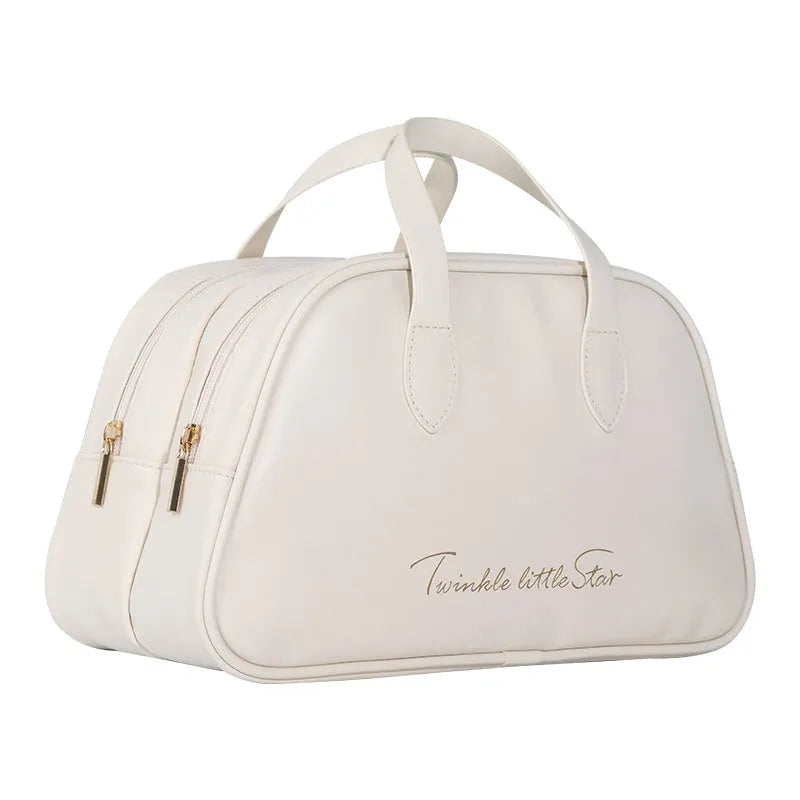Large leather-look travel toiletry bag open showing compartments, in caramel mocha colour.