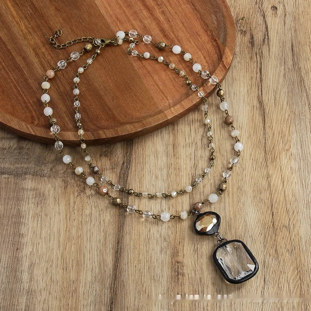 Tribal style two-layer necklace with glass and semi-precious stone pendant on adjustable chain