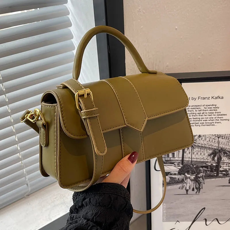Women's beige messenger bag with adjustable strap showing internal file compartment and outer sandwich pocket