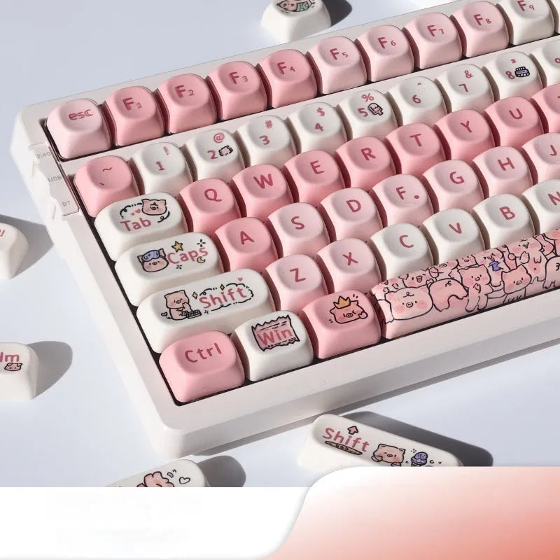 Close-up of a pink pig character artisan key cap for mechanical keyboards with five-sided sublimation printing.