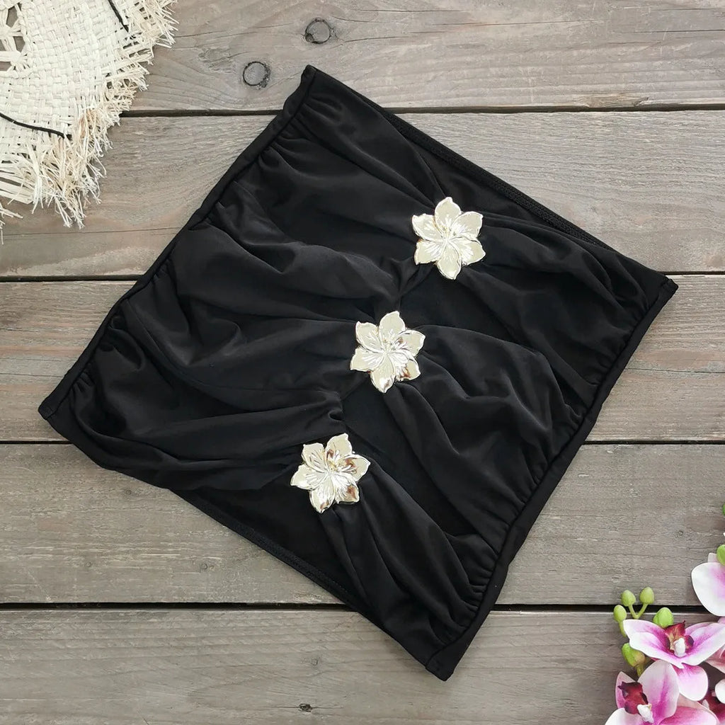 Women's solid colour one-piece swimsuit with high waist, hollow-out tube top, and a matching detachable short skirt.
