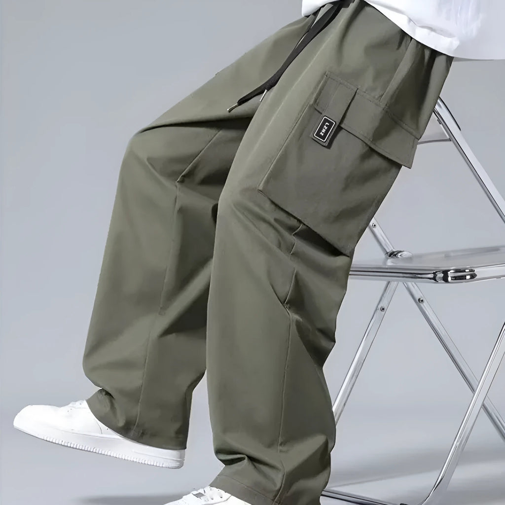 Boys straight leg cargo trousers with drawstring waist and large pockets in polyester fabric