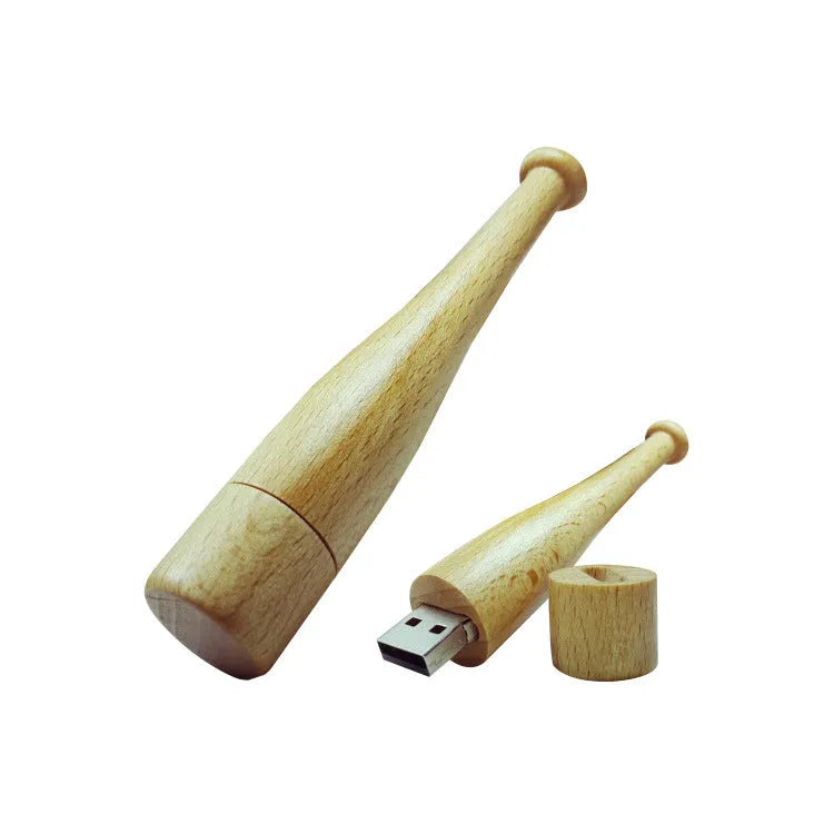 Wooden baseball bat USB flash drive with creative design and USB connector on a light background.