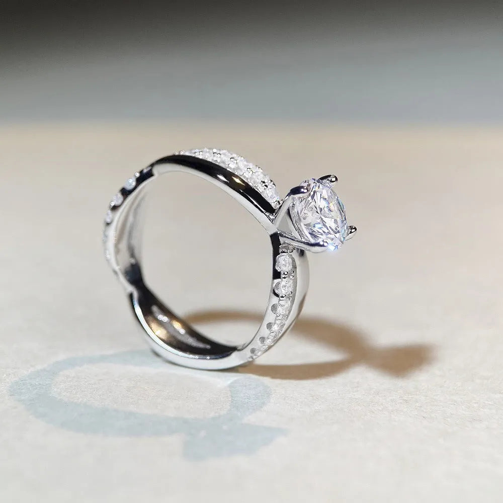 Silver moissanite ring with twisted arm geometric design and 1 carat centre stone