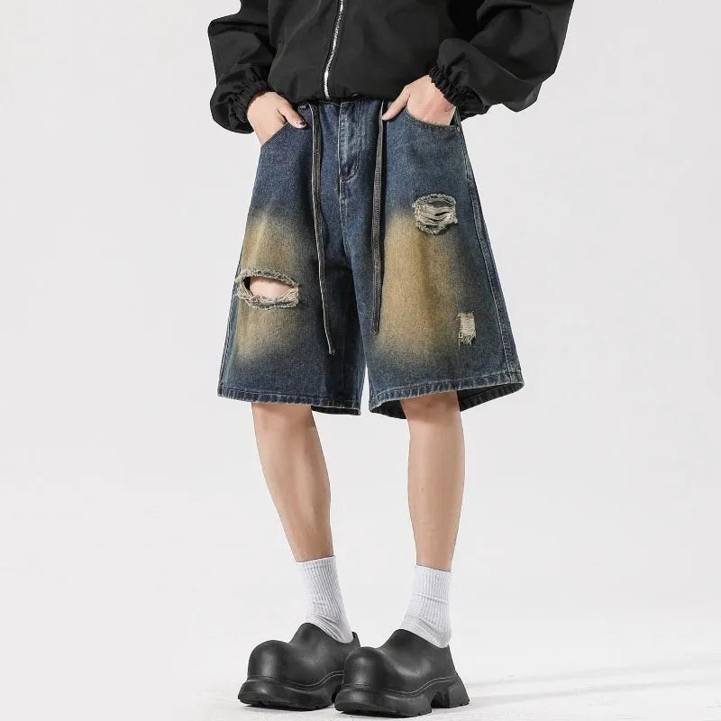 Retro blue loose fit ripped jeans with distressed detailing on denim fabric