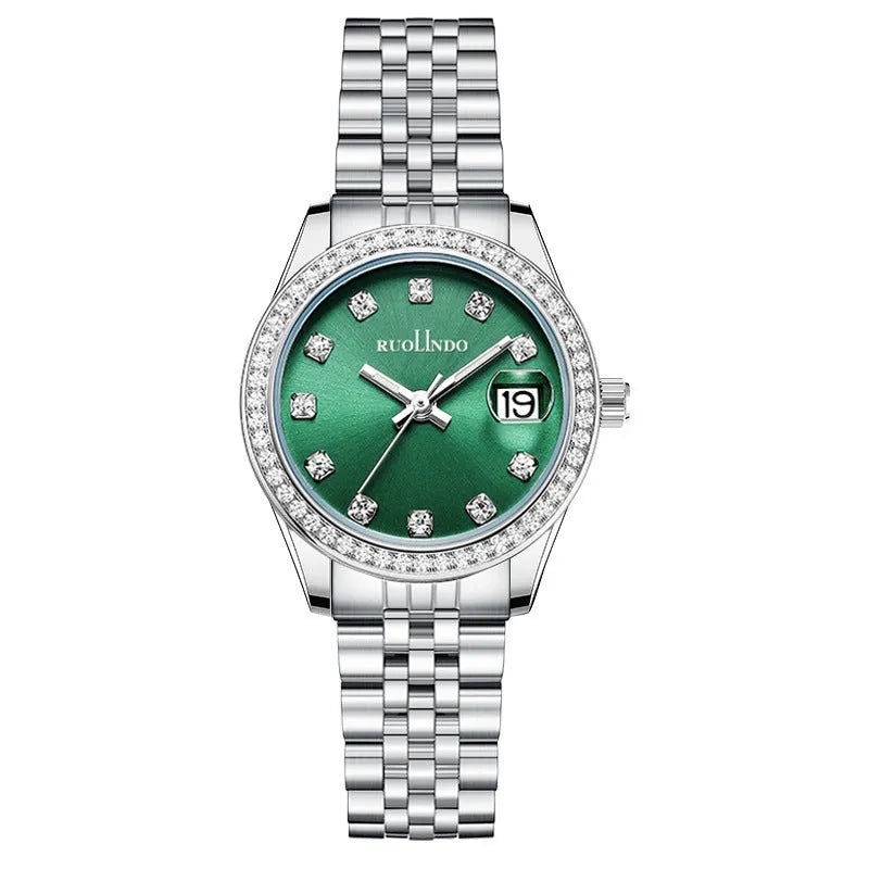 Women's silver alloy quartz watch with circular dial and stainless steel folding buckle on a wrist.
