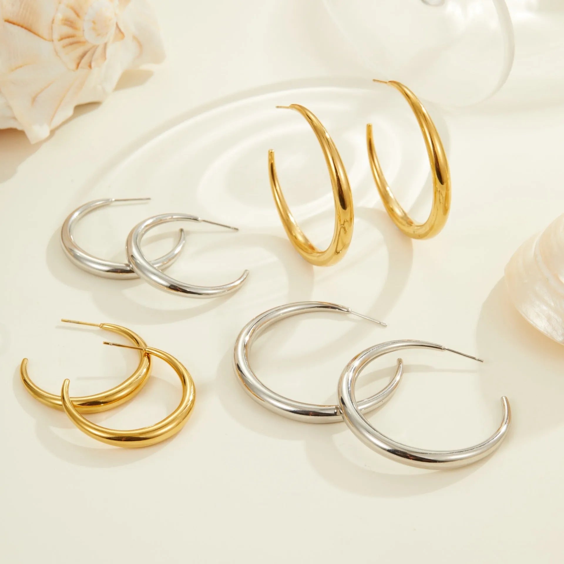 Geometric titanium steel hoop earrings in gold and steel finish options