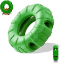 Blue natural rubber tyre-shaped dog chew toy with oval openings for treat dispensing
