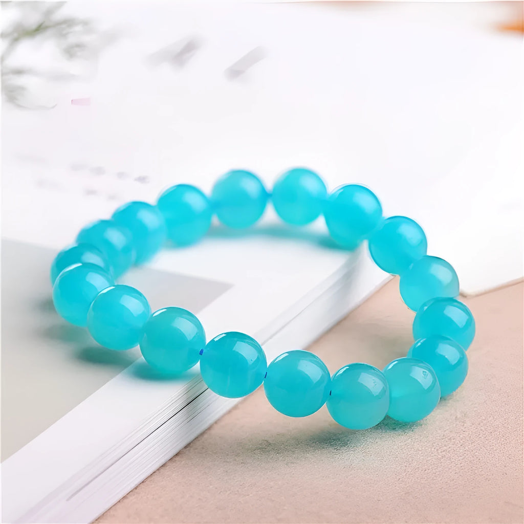 Natural amazonite scattered beads in ice colour grades for jewellery making, showing polished surfaces and size variations