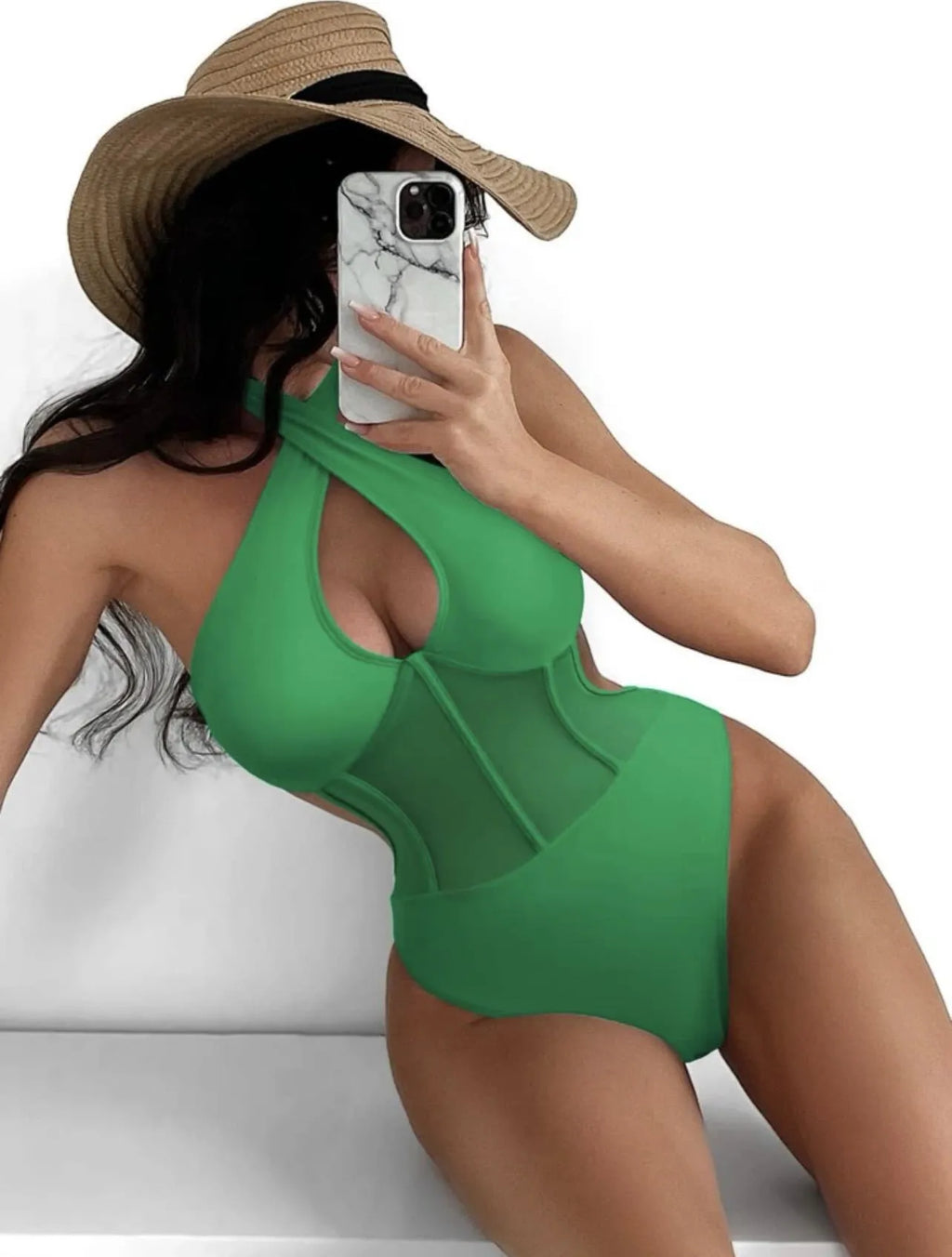 A woman's one-piece bikini swimsuit on a hanger, shown in black, rose red, and green colour options.