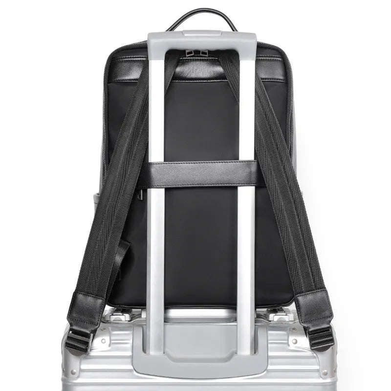 Large black leather men's computer backpack with weaving detail and a physiological curve back.