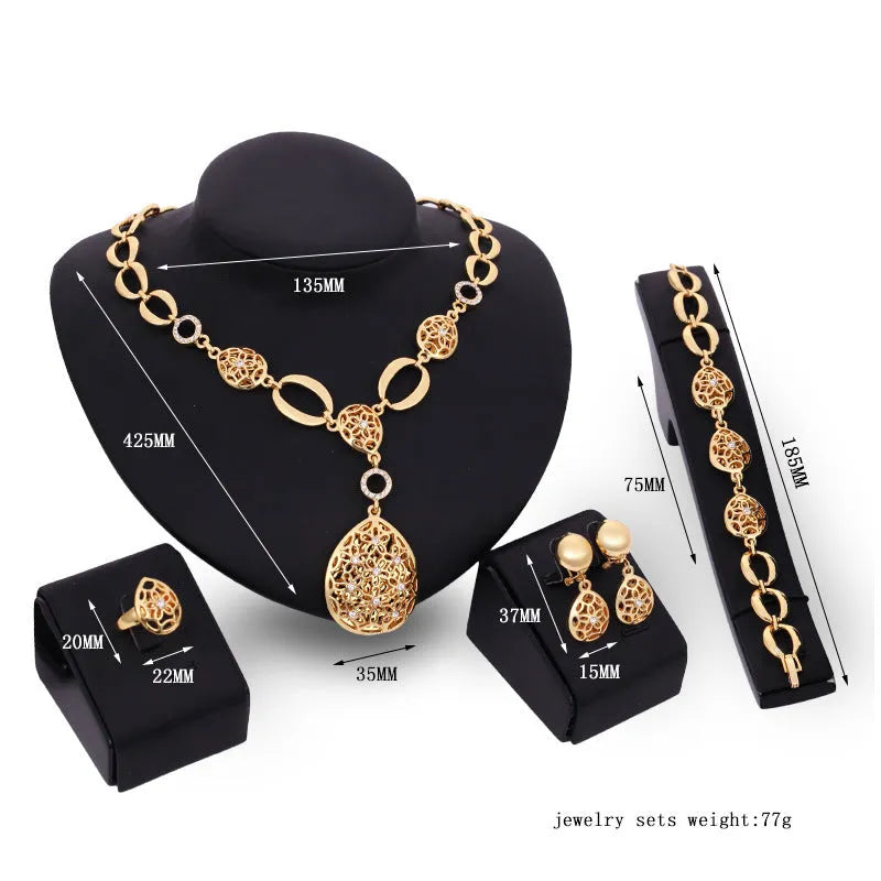 Gold alloy four piece jewellery set including necklace earrings bracelet and ring with bamboo link chain and love water drop bell patterns