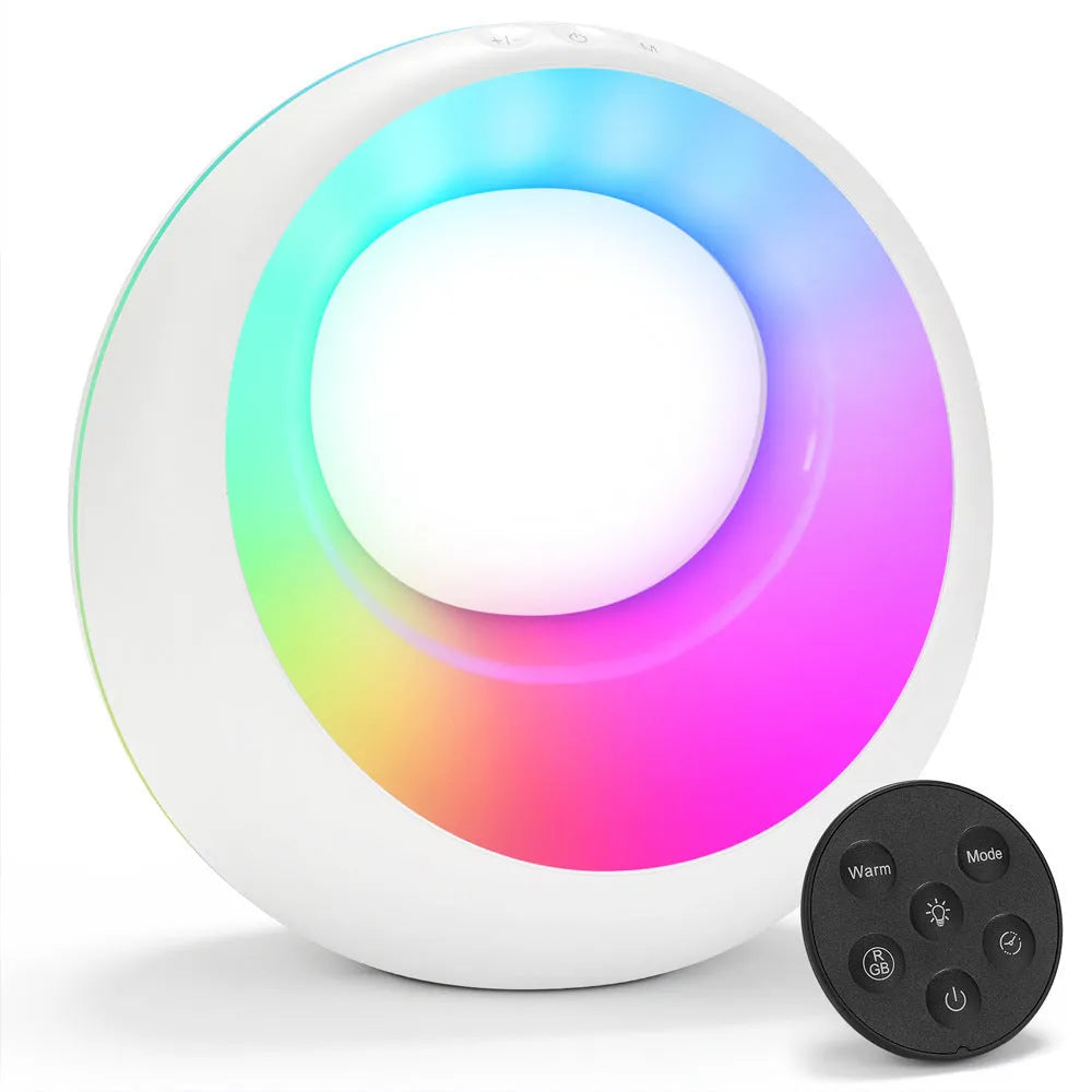 Small white RGB colour changing desk lamp with remote control on a table