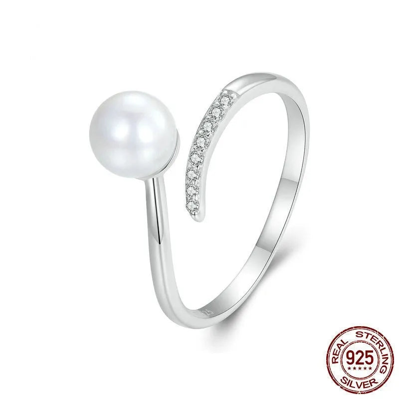 Sterling silver adjustable ring with shell pearls on open loop design