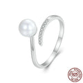 Sterling silver adjustable ring with shell pearls on open loop design