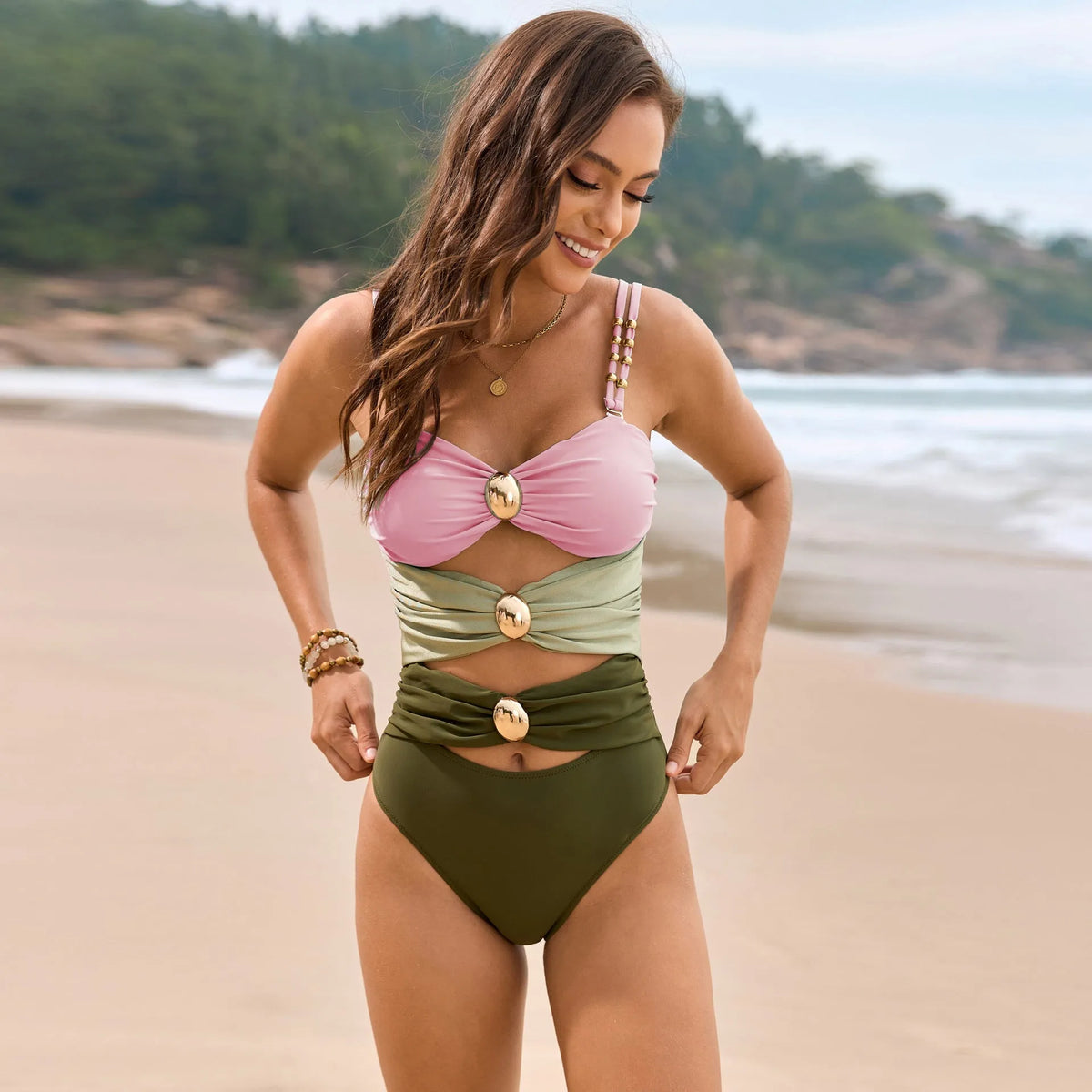Solid colour one-piece swimsuit with stitching and metal buckle detail, nylon fabric, sizes S to XXL