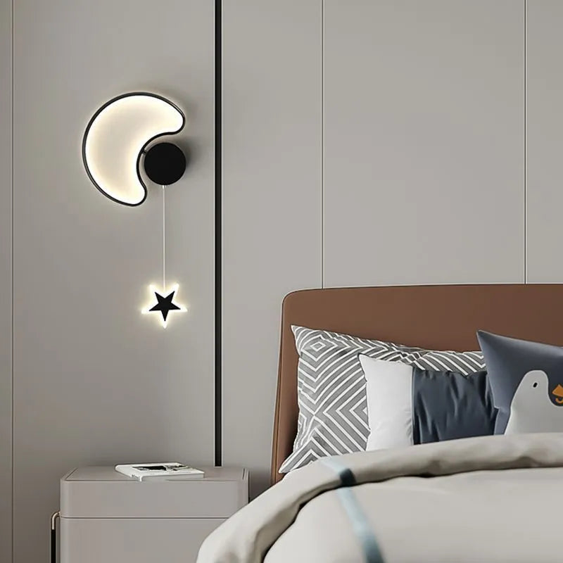 White cloud-shaped children's wall lamp with 3-colour LED light mounted beside a bed.