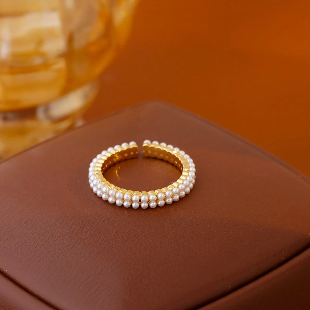 Gold geometric women's ring with a round pearl and open mouth adjustable design.