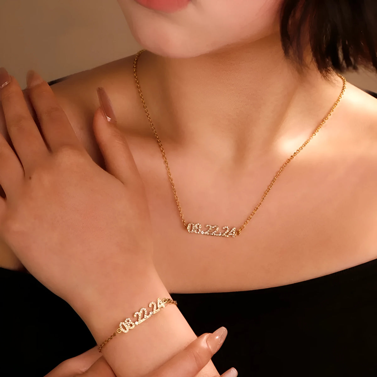Stainless steel digital bracelet and necklace with diamonds on the numbers, shown in gold, rose gold and steel colour options.