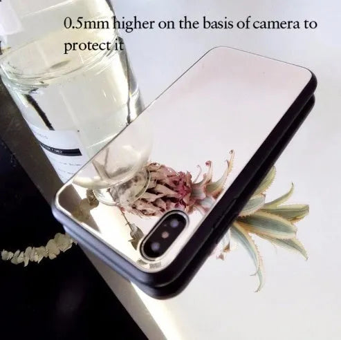 Black iPhone mirror case showing reflective surface on back, compatible with multiple iPhone models