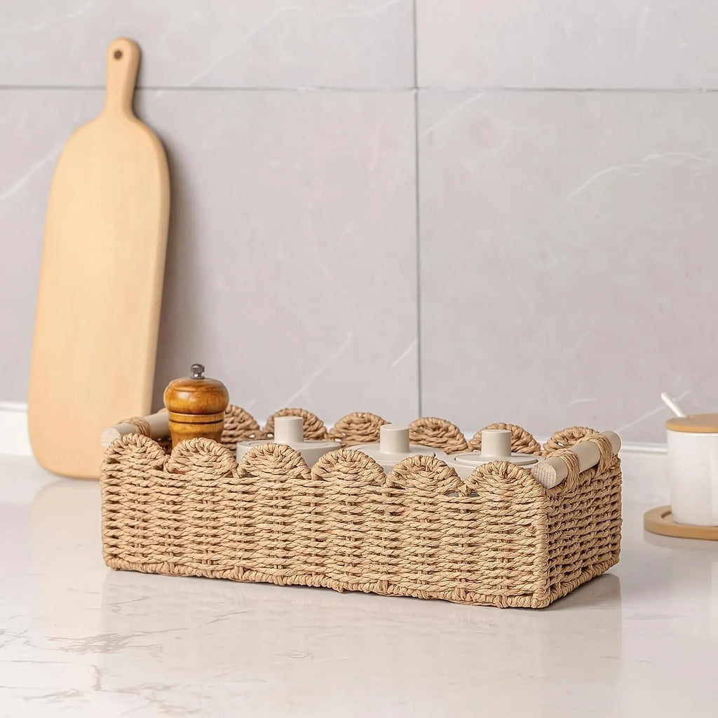 Rectangular woven paper storage basket in a neutral colour on a wooden tabletop.