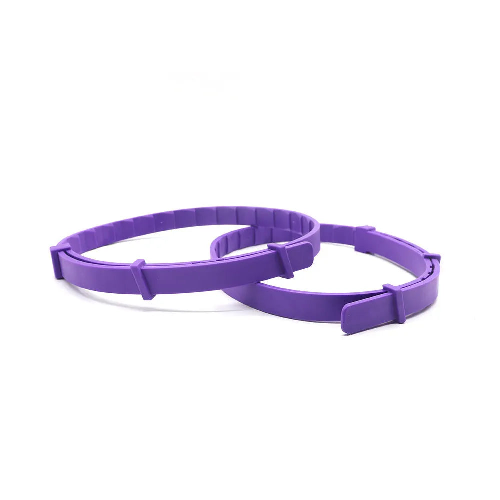 Four dog anxiety relief collars in different colours showing Chinese style monochrome patterns