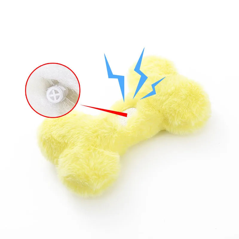 Blue Love Bone shaped plush dog toy with squeaker on a plain background.