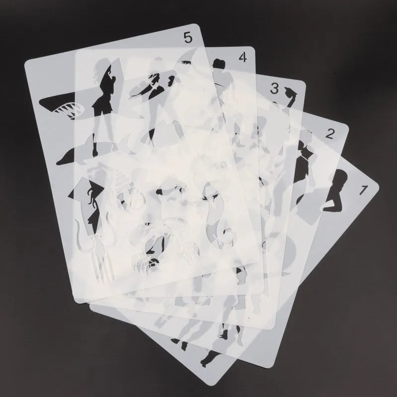 White plastic drawing stencil templates with various pattern designs for craft projects