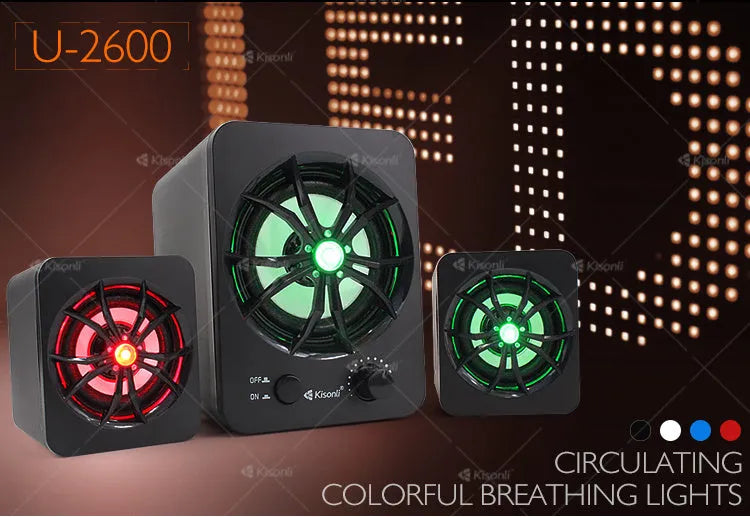 Green USB computer speaker with colourful glow lights showing 2.1 channel audio ports