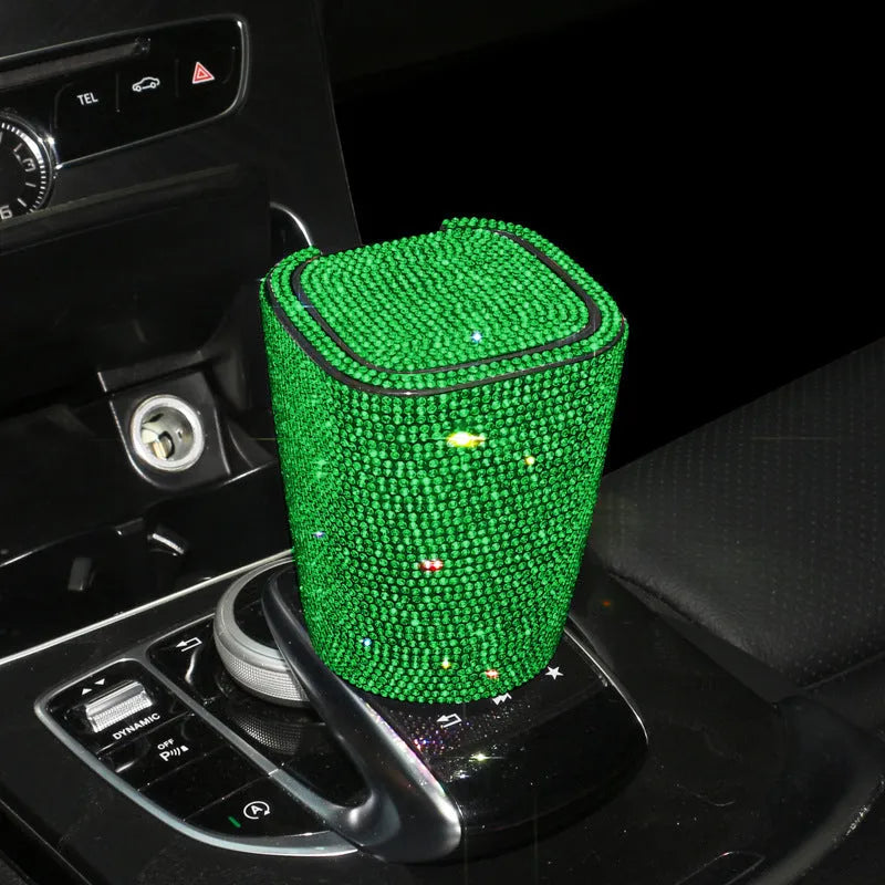 Diamond-embedded car ashtray with lid, air outlet hanging design, plastic cast body, available in nine colours.