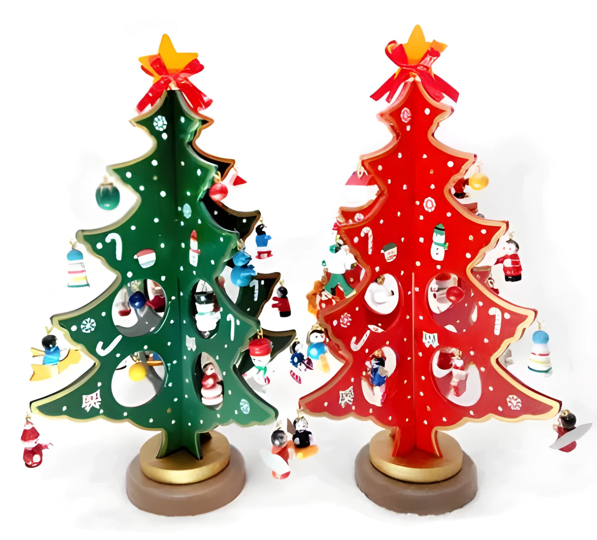 Hand painted wooden Christmas tree decorations in red and green colours on desktop