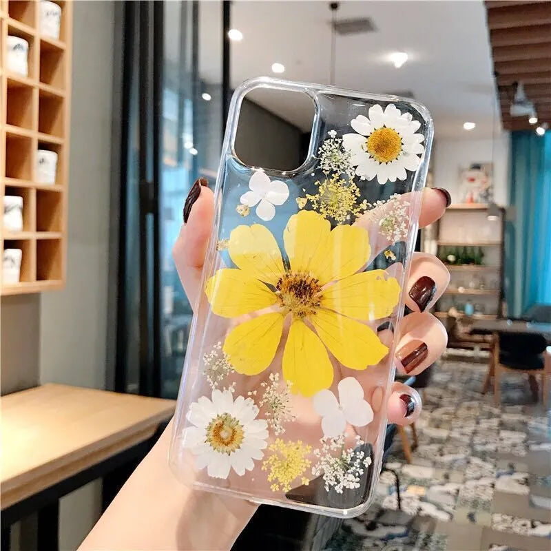Pink and yellow floral patterned TPU iPhone case showing large flower design on back cover
