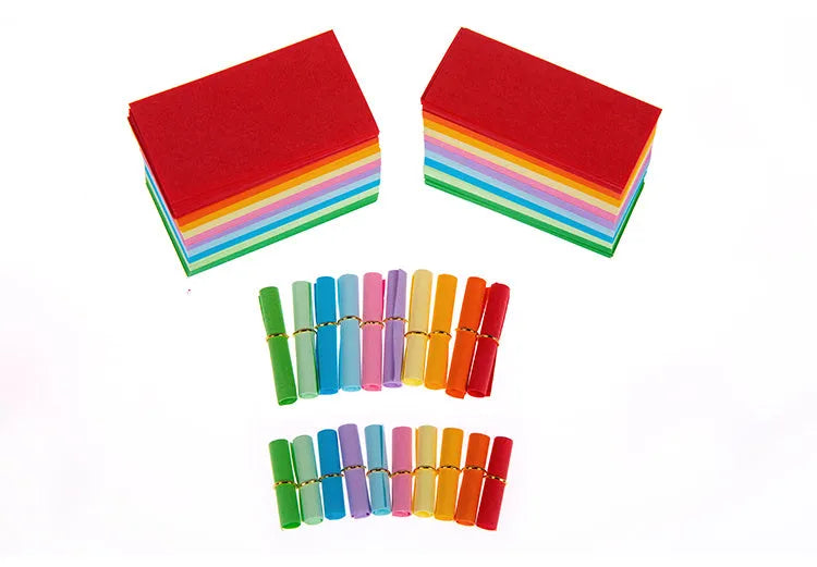 Assorted coloured mini paper scrolls with eyelets in 3x7cm and 7x7cm sizes for drift bottles