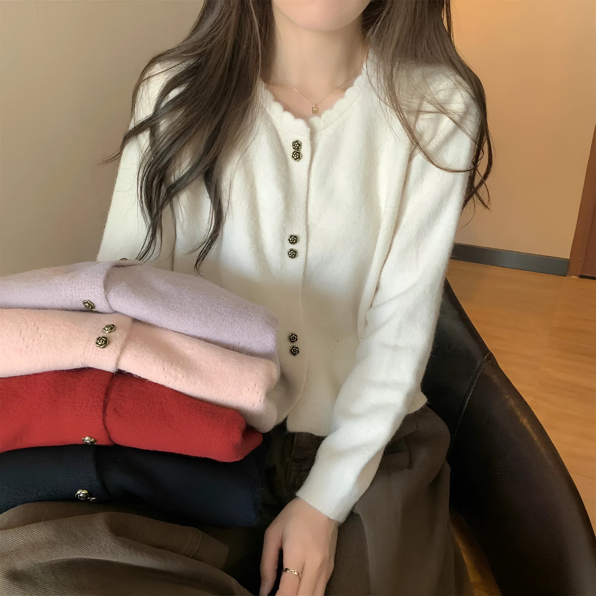 Women's long-sleeved acrylic cardigan sweater in free size showing colour options