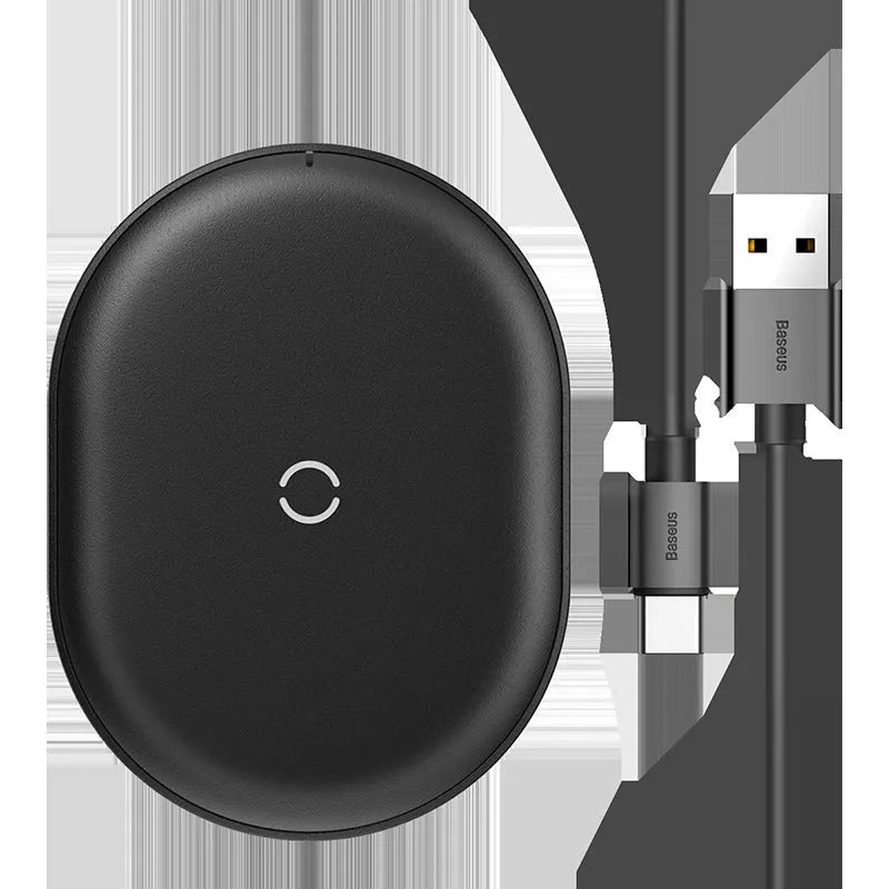 Baseus Rough 15W fast wireless charging pad for mobile phones in black colour on a desk.