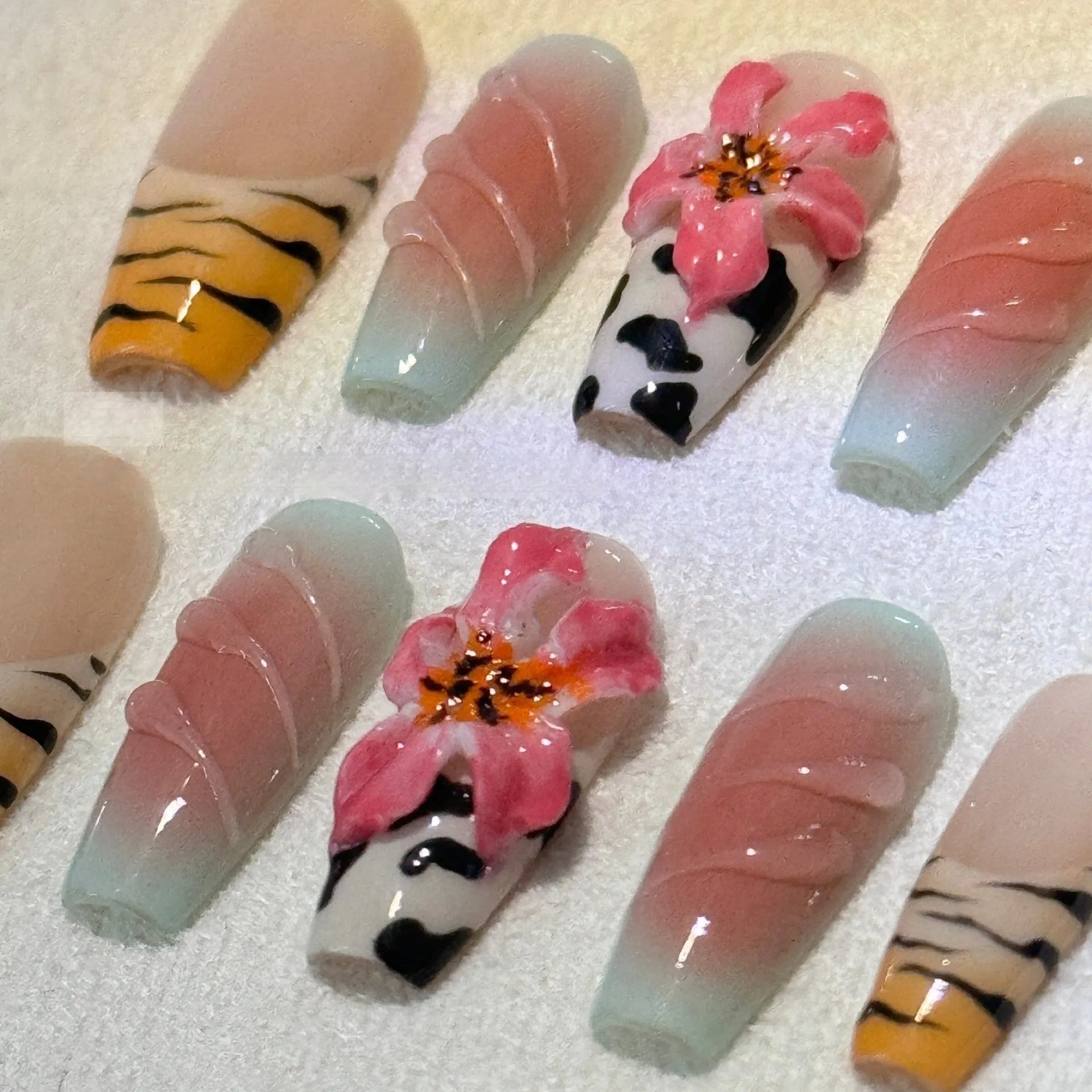 Zebra pattern lily hand carving nail art with embossed flower and leopard print designs