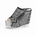 Women's black platform sandals with a hollowed-out chunky heel, mesh upper, and lace-up front.