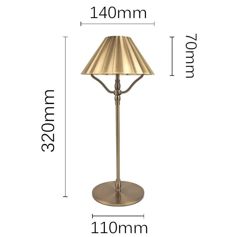Gold-coloured alloy desk lamp with a shade, showing a USB-C charging port and touch control.
