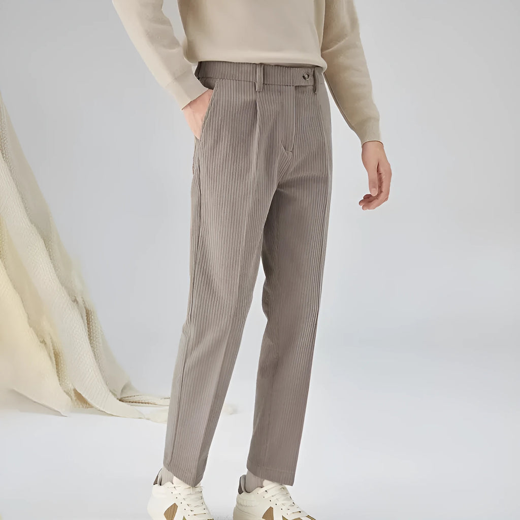Men's beige corduroy straight leg loose fit trousers with a mid-rise elastic waistband.
