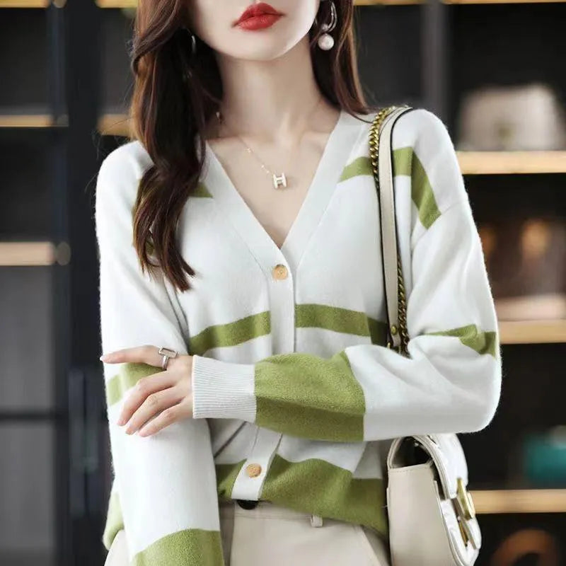 Women's black and white striped knitted cardigan with 3D pattern, V-neck, and button-up front.