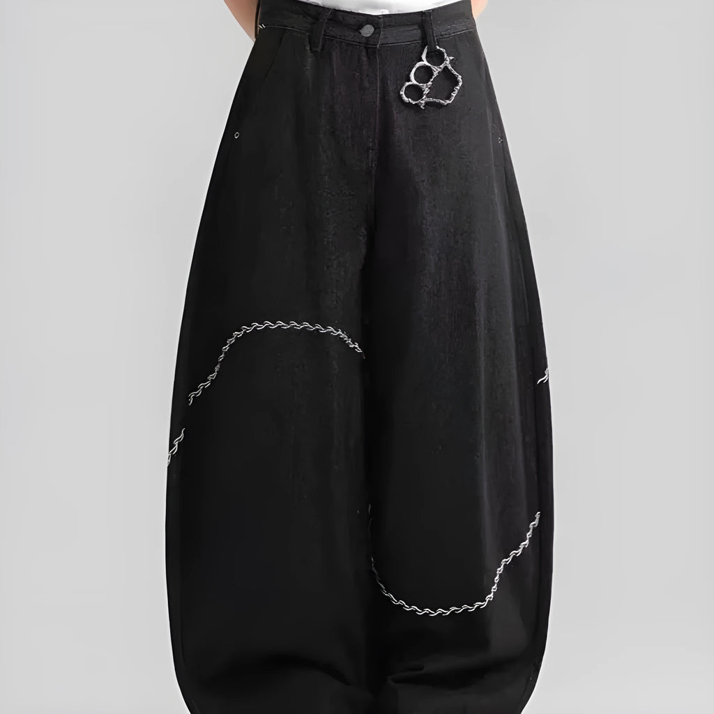 Black straight-leg men's trousers with a mid-waist and zip fly on a hanger.
