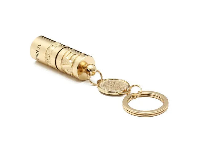 Gold zinc alloy mini LED keychain flashlight with a waterproof case and emergency light function.