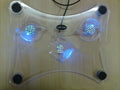 Transparent laptop cooling pad with three fans, 290mm x 160mm x 40mm inclined body and four rubber pads