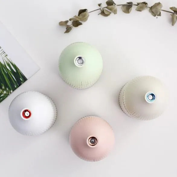 White ultrasonic aromatherapy diffuser and humidifier with LED light, 300ml capacity, and USB cable